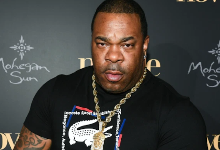 Busta Rhymes in a black t-shirt poses a picture.